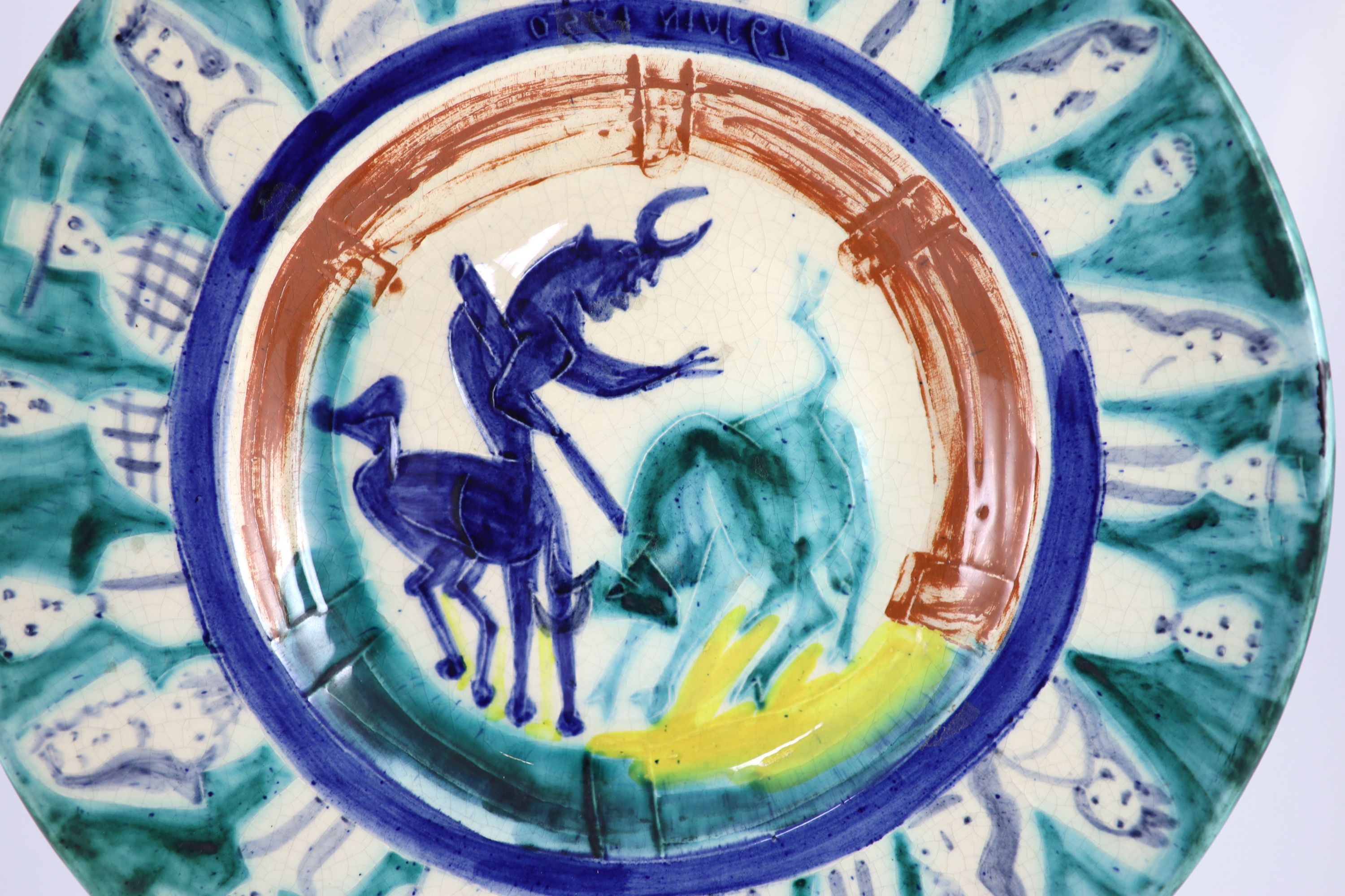 Pablo Picasso (Spanish 1881-1973) for Madoura pottery, a Corrida aux Personnages charger (A.R.104), designed 1950, the rare reverse painted with a faun holding a branch, signed and inscribed ‘Picasso, 1st Septembre 1951’